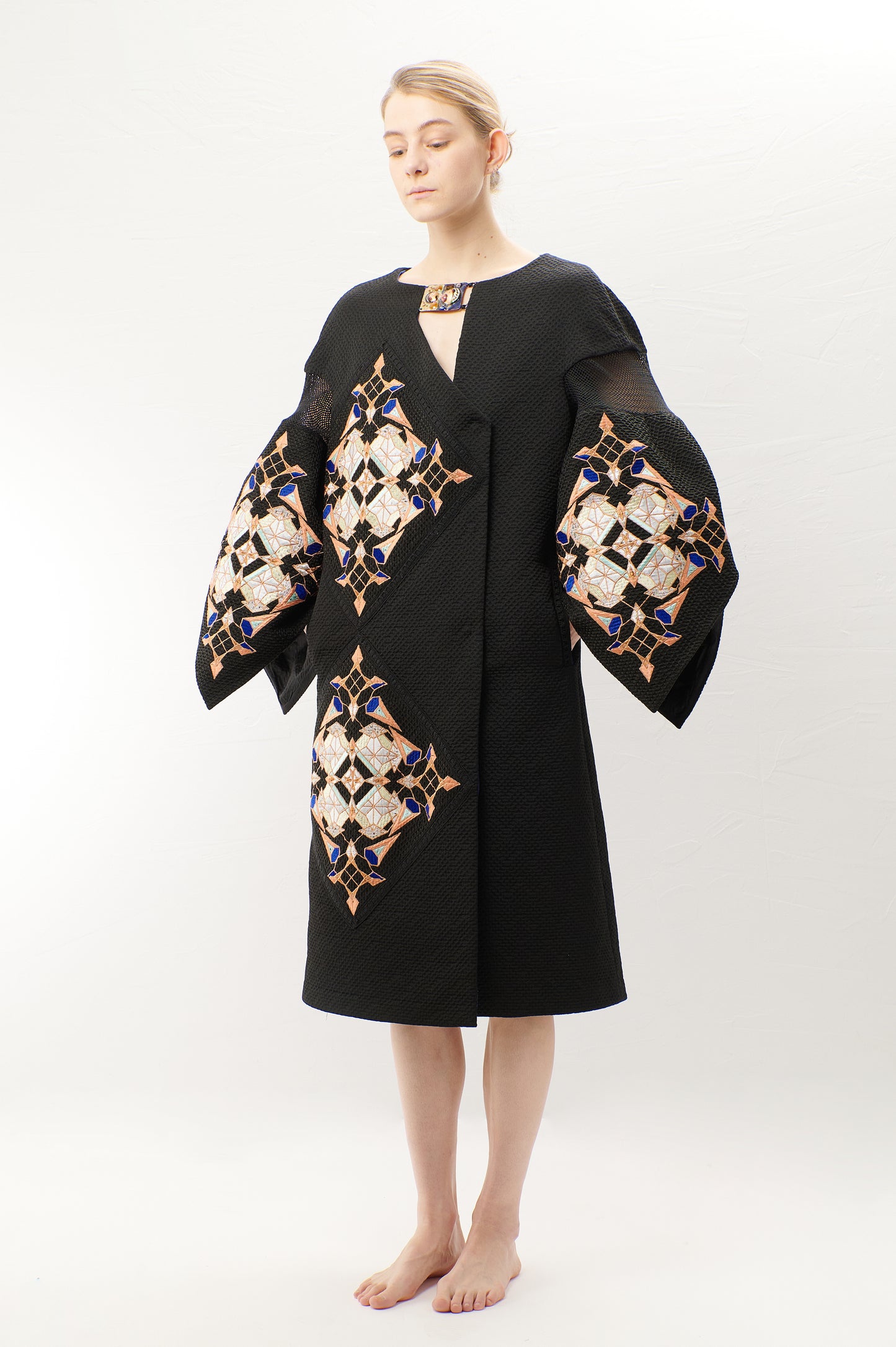 Double-breasted A-line black jacquard coat